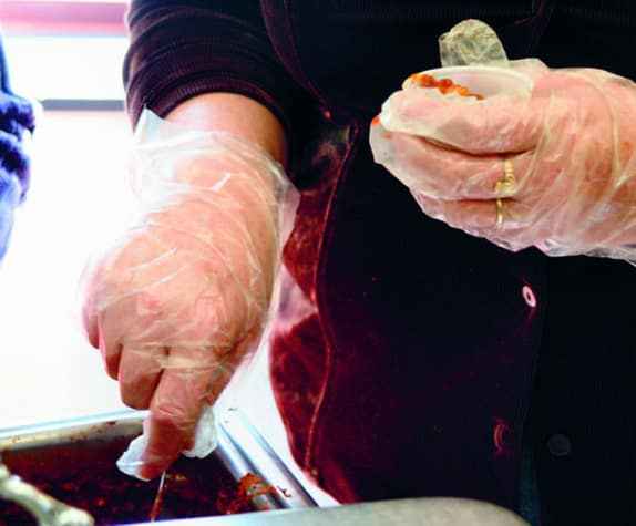 Kitchen safety eBook cover showing hygiene in the kitchen with food preparation and microbes